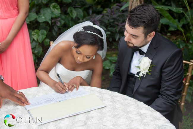 Bride signs the register